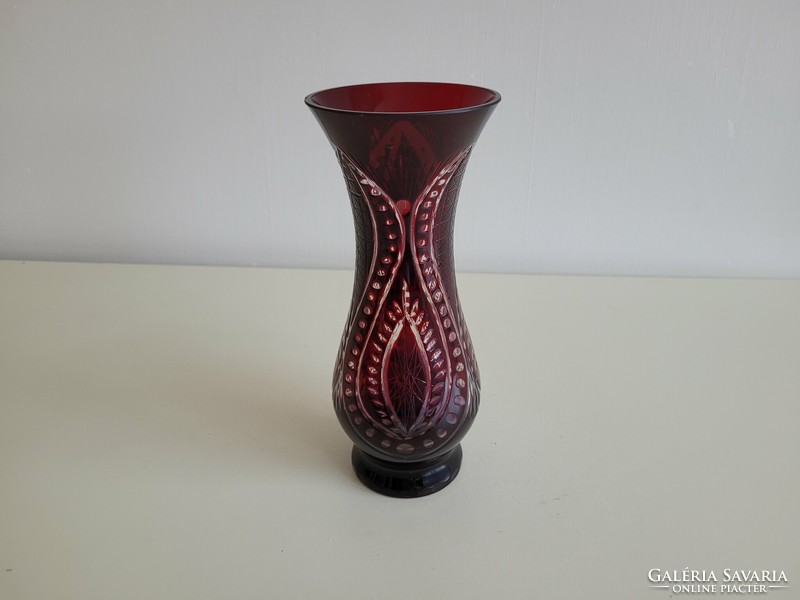 Old burgundy crystal vase with polished glass vase