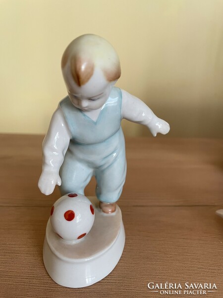 Child kicking a ball - Zsolnay porcelain
