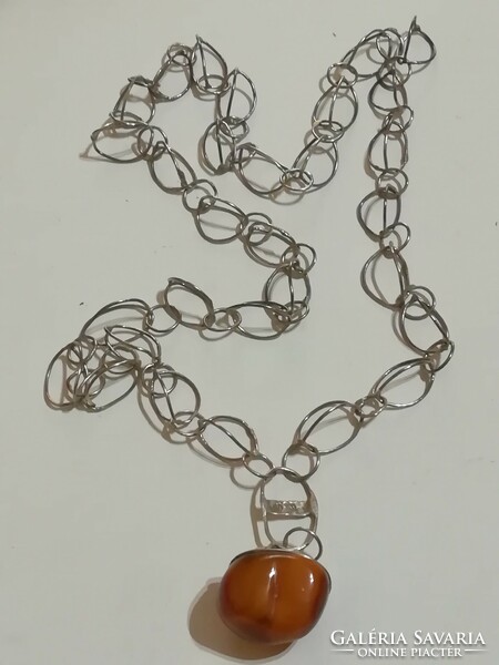 Antique silver chain with amber pendant.