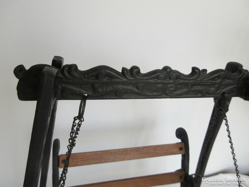 Old, decorative wrought iron and wooden baby swing. Negotiable!