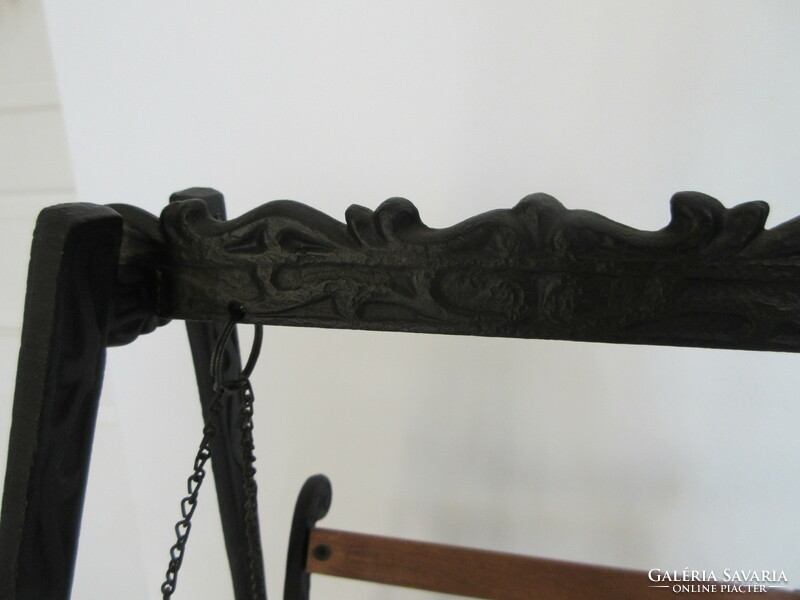 Old, decorative wrought iron and wooden baby swing. Negotiable!