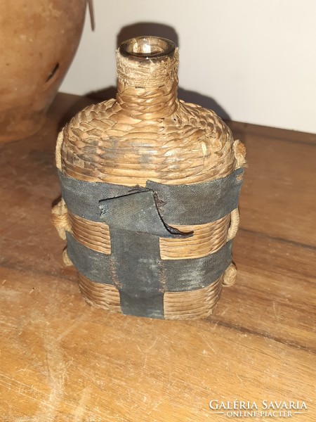 Regi glass bottle, in a wicker case