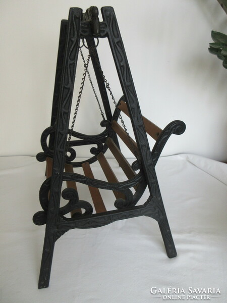Old, decorative wrought iron and wooden baby swing. Negotiable!