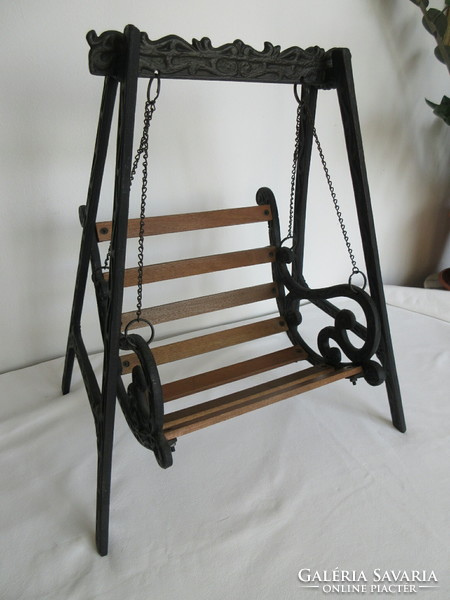 Old, decorative wrought iron and wooden baby swing. Negotiable!