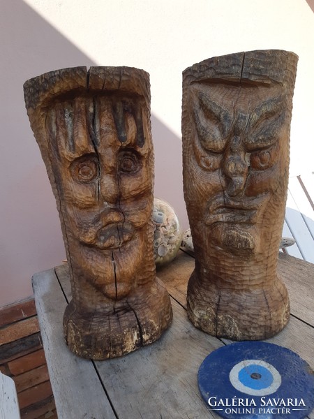 Huge wooden heads, wood carving