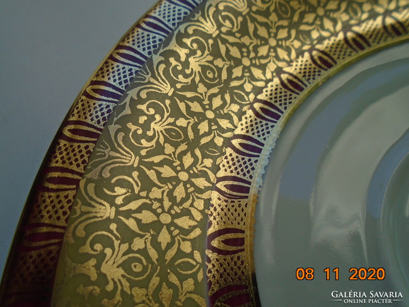 Rich gold brocade with burgundy patterned tea cup with saucer