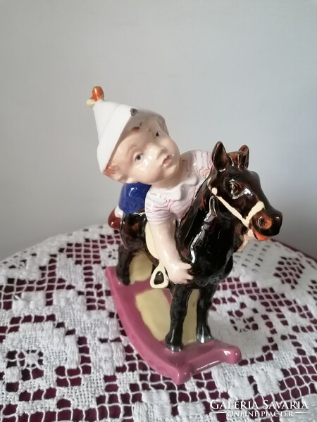 Retro ceramic little boy with rocking horse