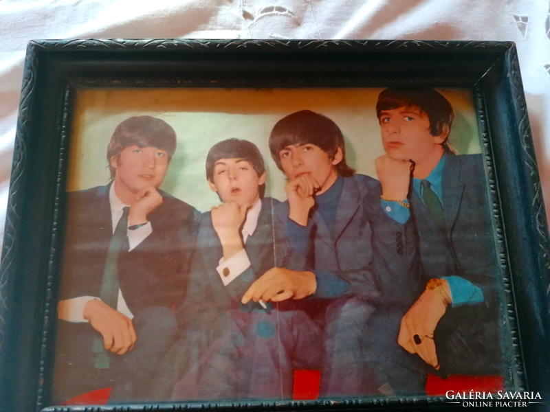 Beatles photo in frame under glass