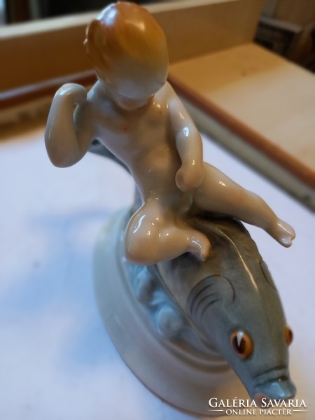 Herend putto on the fish.