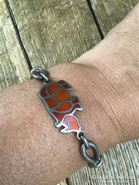 Old silver bracelet with rhinoceros decorated with fire enamel