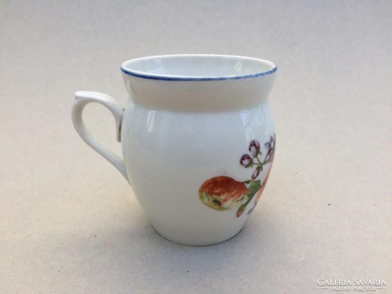 Old porcelain mug with silk apple flowers