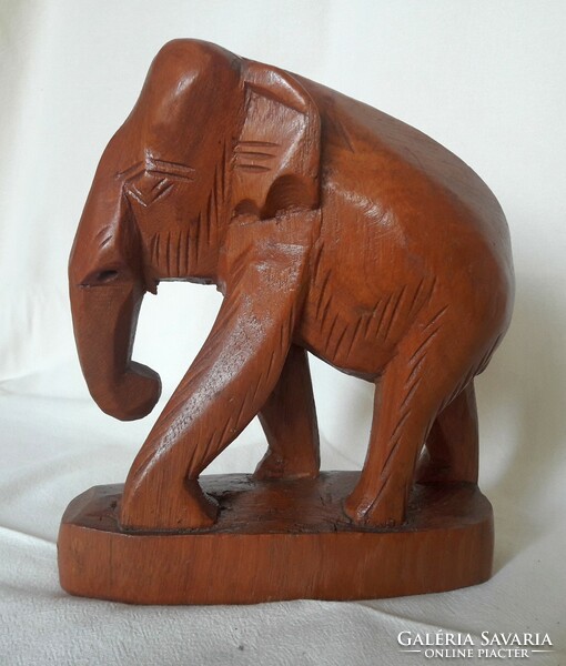 Hand-carved teak elephant statue from Thailand, also suitable as a bookend