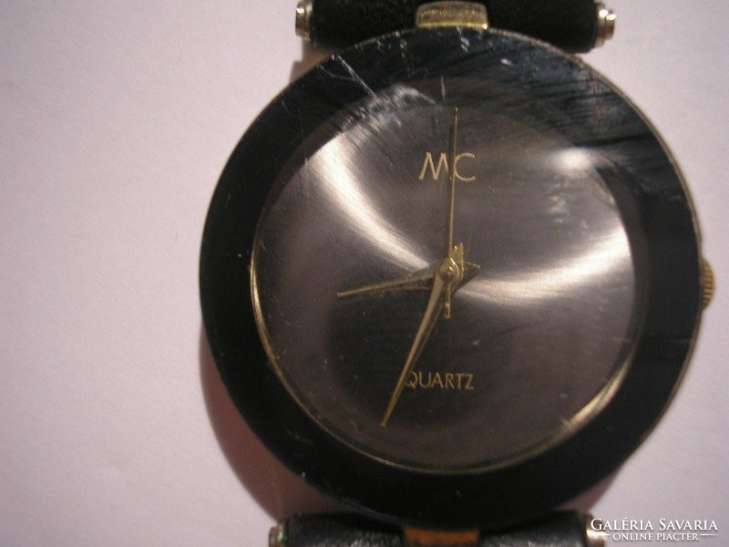 Mc quartz working watch with black strap