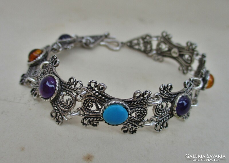 Beautiful silver bracelet with precious stones