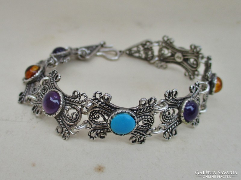 Beautiful silver bracelet with precious stones