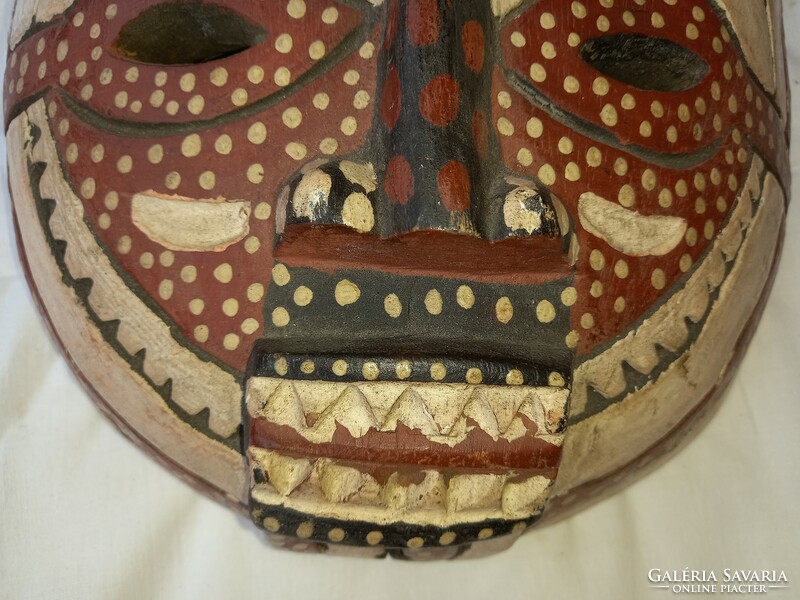 Carved wooden mask can be negotiated from a special collection