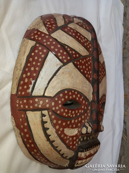 Carved wooden mask can be negotiated from a special collection