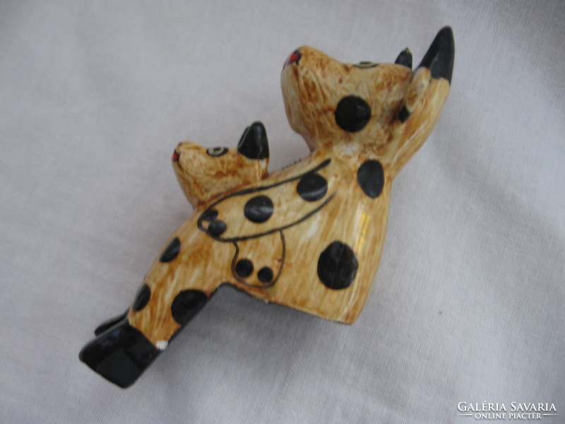 Sitting polka dot boci and cow made of wood