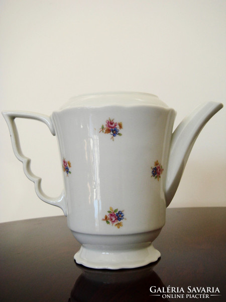 Old zsolnay porcelain teapot with floral tea pouring