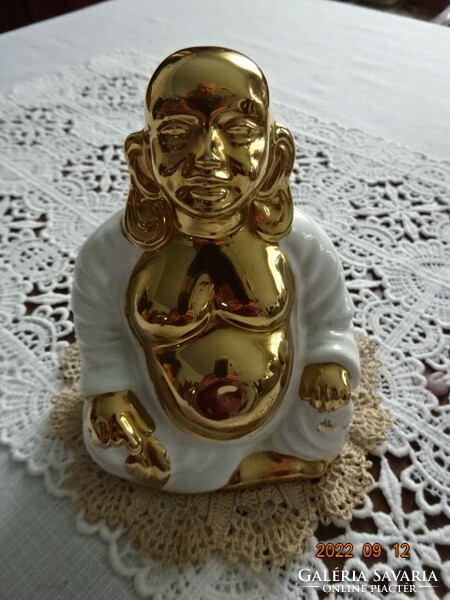 Porcelain Buddha statue, richly gilded, height 11.5 cm. He has!