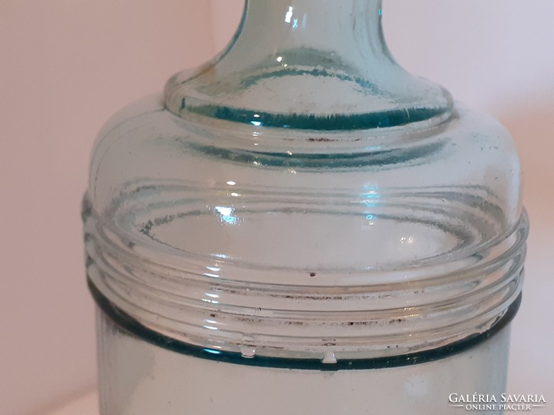 Old blue striped bottle with vintage ink bottle