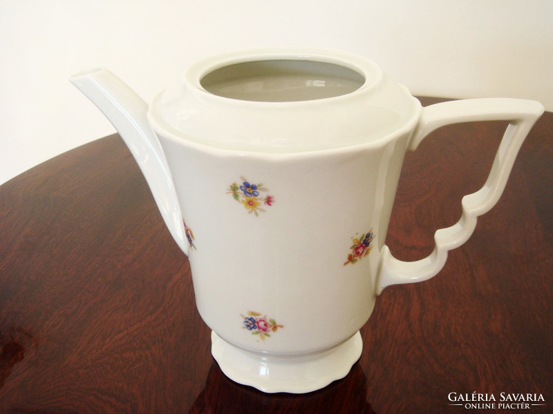 Old zsolnay porcelain teapot with floral tea pouring