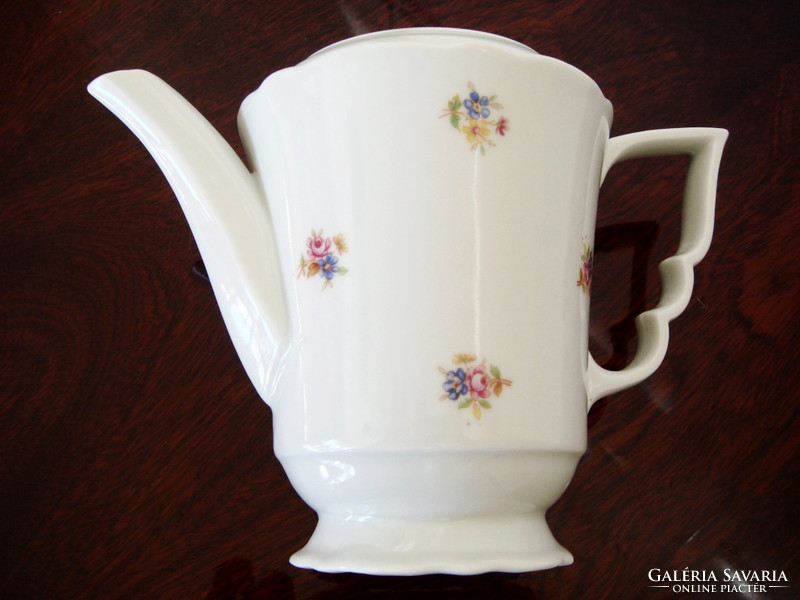 Old zsolnay porcelain teapot with floral tea pouring