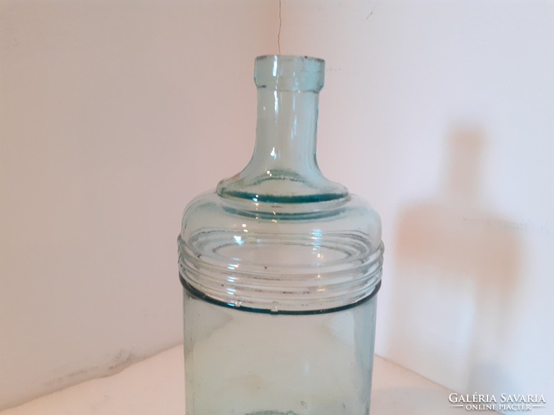 Old blue striped bottle with vintage ink bottle