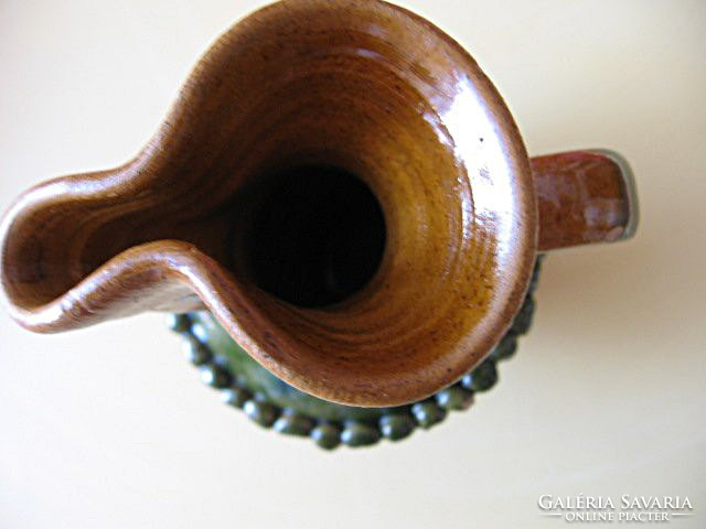 Small retro signaled ceramic jug with spout