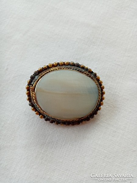 Old mother-of-pearl brooch pin