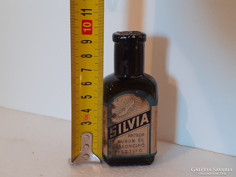 Old chemical bottle labeled silvia shoe polish bottle