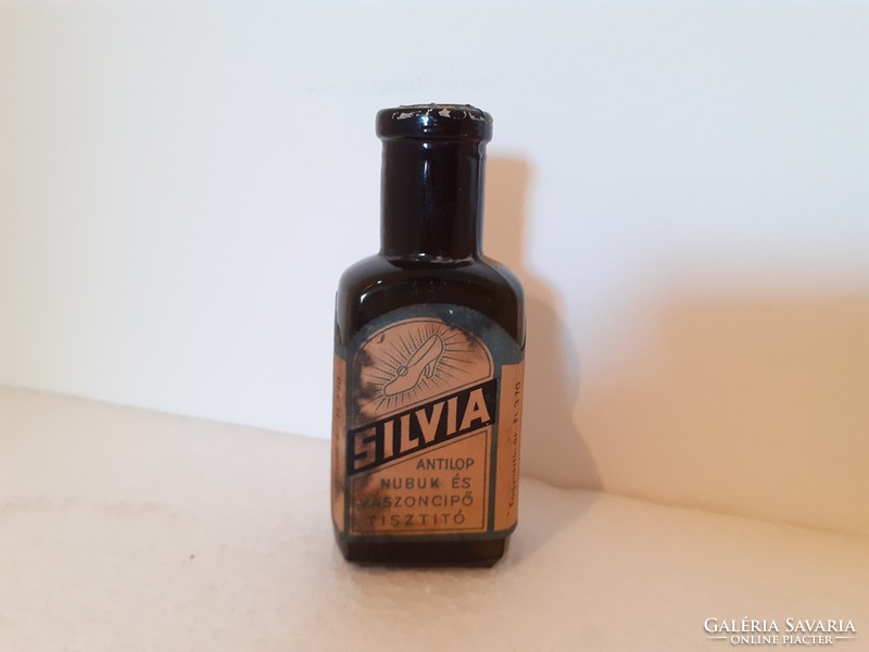 Old chemical bottle labeled silvia shoe polish bottle