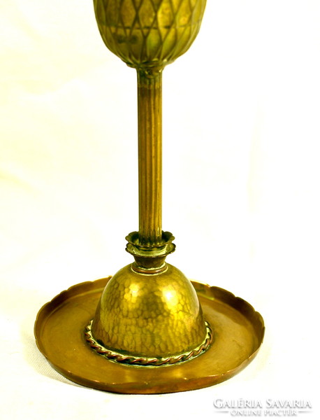 A large copper goblet with a rustic appearance!