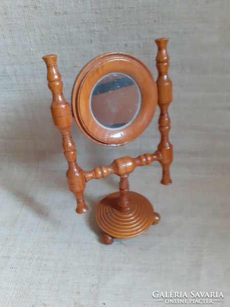 Old pewter mirror on the table