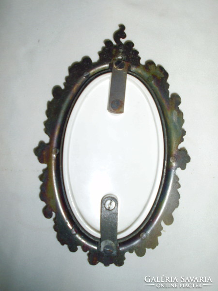 Decorative oval picture frame with a print on a convex base