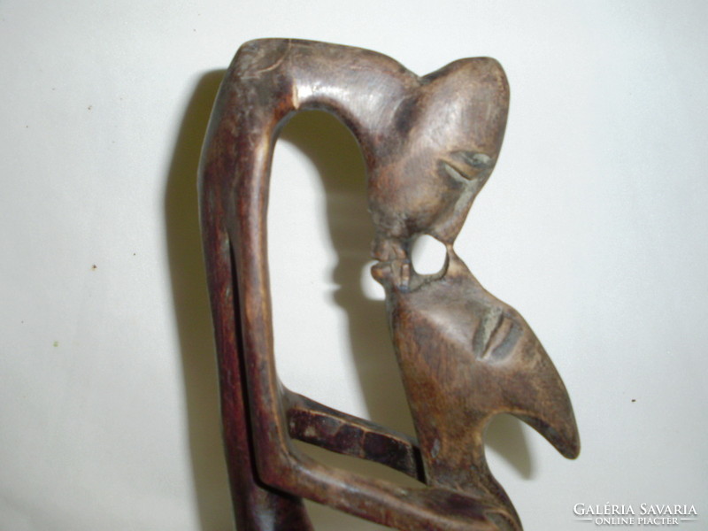 Oriental wooden sculpture - kissing couple