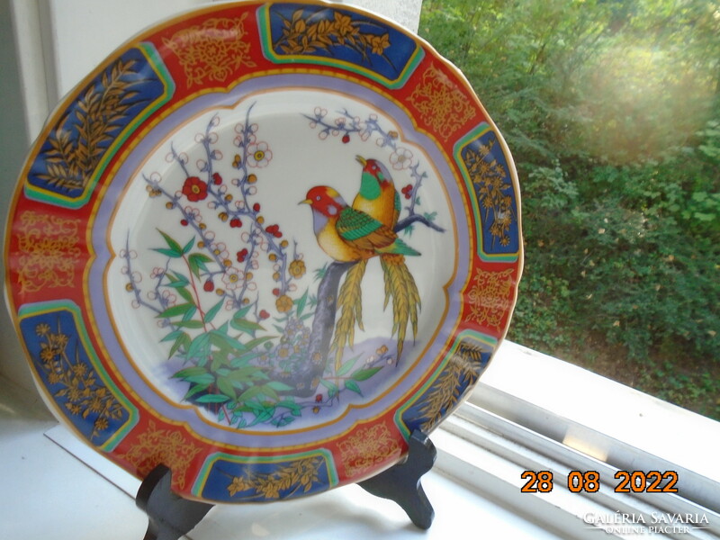 Hand-painted oriental marked wall plate with a bird flower pattern with bright protruding colors