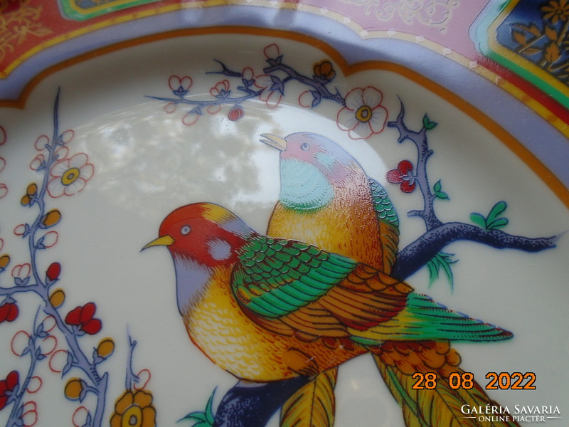 Hand-painted oriental marked wall plate with a bird flower pattern with bright protruding colors