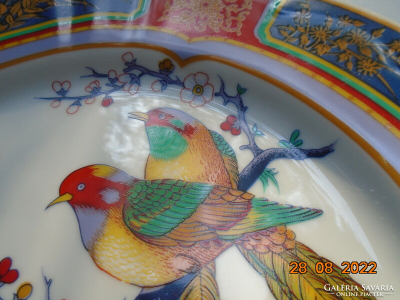 Hand-painted oriental marked wall plate with a bird flower pattern with bright protruding colors