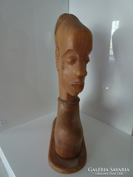 African female head on a tree.