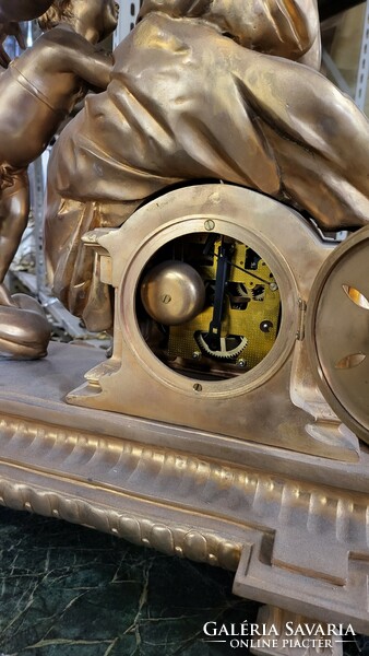 Fire-gilt bronze Empire mantel clock with candle holders