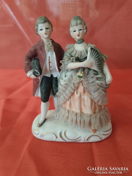 Antique porcelain love figurine with lace