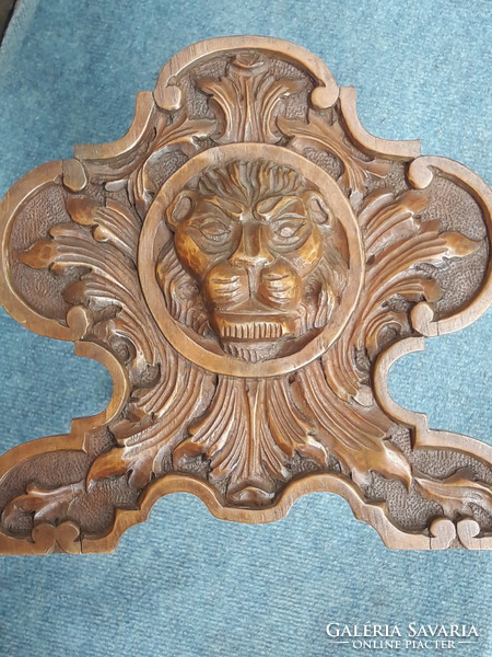 Beautifully carved lion book cradle