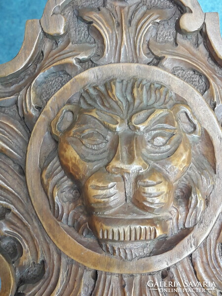 Beautifully carved lion book cradle