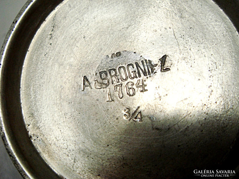 Old metal spout in vintage small jug
