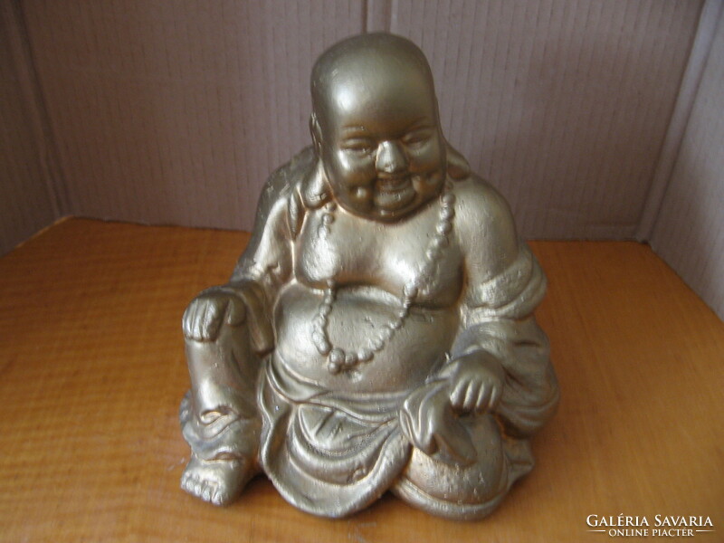 Buddha statue sitting, pot-bellied, smiling