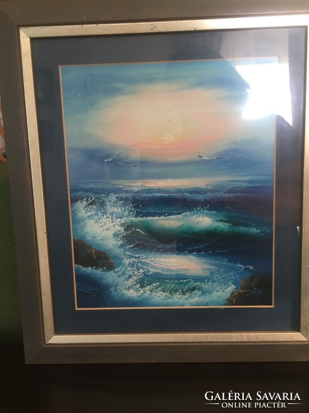 A painting depicting the sea, in a picture frame