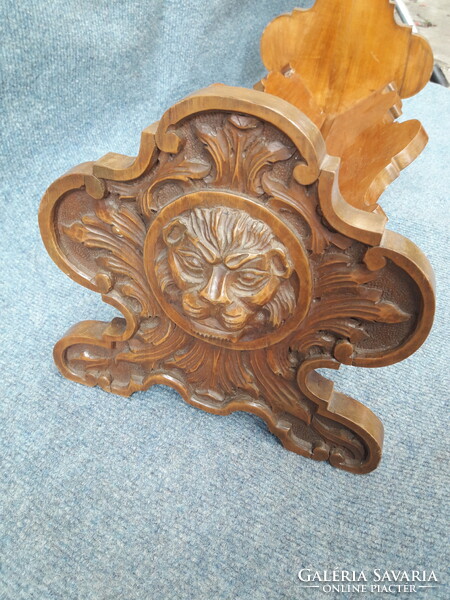 Beautifully carved lion book cradle