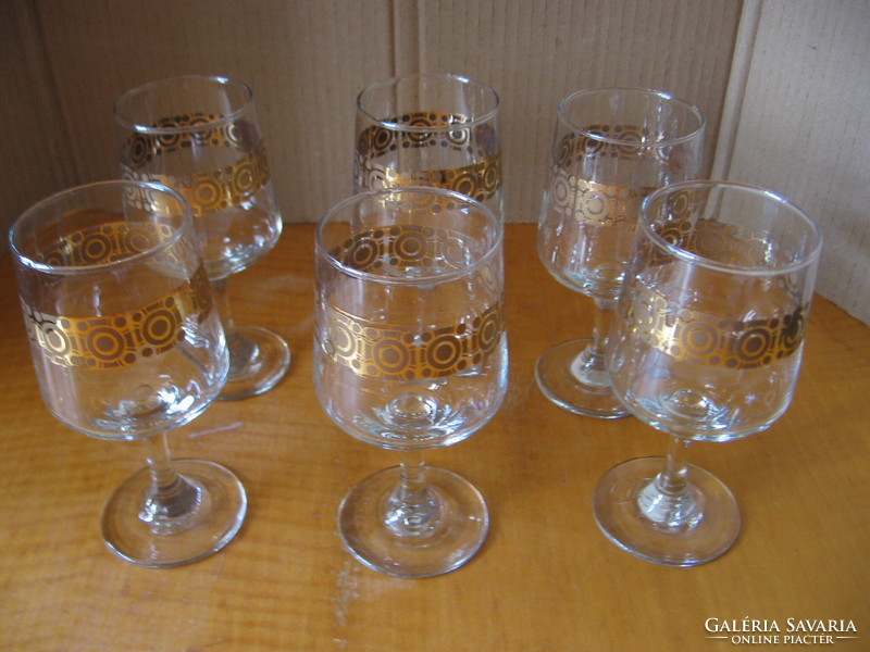 Set of retro gilded cognac and wine glasses