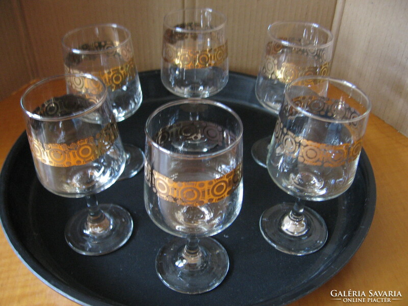 Set of retro gilded cognac and wine glasses